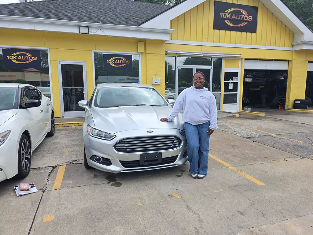 10K Autos customer driving home happy in Greenville